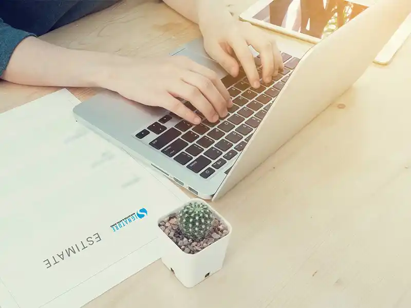 Person typing on laptop
